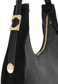 Black handbag featuring a mix of suede and glossy patent leather, gold hardware accents, a zip closure, and an oval logo detail.