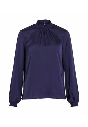 Granatowa bluzka z gładkiej tkaniny, z wysokim marszczonym kołnierzem i długimi rękawami zakończonymi marszczonymi mankietami. Prosty krój o luźnym fasonie.