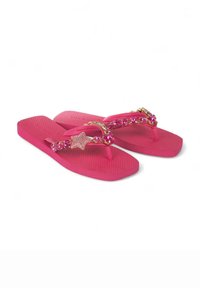 Chanclas de goma rosas con suelas texturizadas y tiras en forma de thong adornadas con rhinestones, incluyendo un acento en forma de estrella.