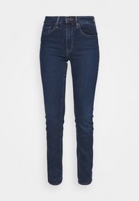 Smaljeans i mörkblå denim med en slät textur. Har en medelhög midja, fem fickor och en klassisk knäppning fram.