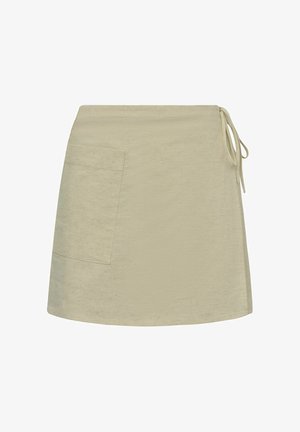 Gonna in cotone beige misto con tasca laterale, vita con lacci e una finitura leggermente strutturata, caratterizzata da un orlo dritto e un design minimal.