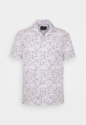 Chemise blanche à manches courtes avec boutons, col à revers et motif de points gris irréguliers, marque Mads Nørgaard Copenhagen.