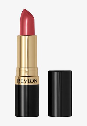 Revlon lipstick in een rozenrode tint, verpakt in een gouden en zwarte tube. Heeft een slank ontwerp en een semi-matte afwerking. Dop verwijderd.