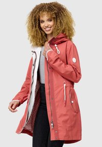 Water-resistant coral raincoat with a white lining, zip closure, adjustable drawstring hood, and side pockets featuring buttons.