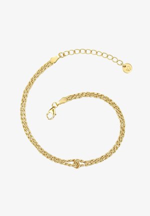 Kuldne punutud ketikäevõru, millel on klamber ja reguleeritav pikkus, ning millel on ühes otsas ringikujuline ripats sümboliga.