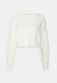 Vitt kort stickat tröja med ett texturerat vävt mönster, långa ärmar och ribbade kanter vid halsringning och fåll.