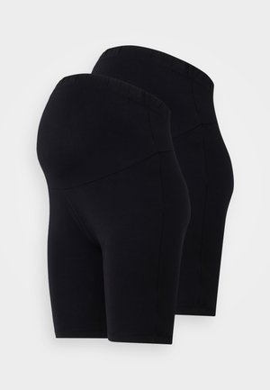 Shorts d'entrainement noirs en stretch avec une taille haute, présentant une texture lisse et un design simple. Vendus par paquet de deux.