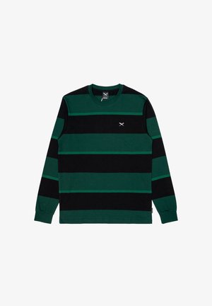 T-shirt a maniche lunghe con righe verdi scure e nere, colletto rotondo e un piccolo logo sul petto. Realizzato in morbido cotone.