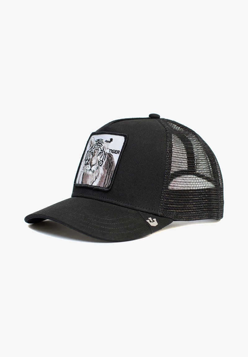 Schwarze Trucker-Cap mit Netzrücken, mit einem gestickten Tiger-Patch auf der Vorderseite und einem gebogenen Schild. Kleines Logo an der Seite.