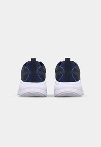 Navy athletic shoes with a textured upper, white midsole, and pull tab. Features curved lines and a breathable design for comfort.