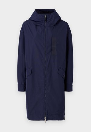 Navy blue raincoat with a hood, full-length zipper, side pockets, and a rectangular velcro patch on the front. Made of smooth, water-resistant material.