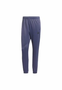 Pantalones deportivos azules hechos de tela ligera; diseño ajustado con cintura elástica; cuenta con bolsillos laterales y logo negro en la parte delantera.