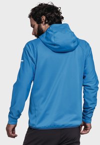 Blauer Kapuzenpulli mit einer weichen, strukturierten Oberfläche, ausgestattet mit einer Kapuze und langen Ärmeln. Der Rücken zeigt eine lässige Passform mit minimaler Markenkennzeichnung am linken Ärmel.