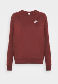 Bordeauxfärgad Nike sweatshirt, mjukt tyg, rund halsringning, raglanärmar, ribbade ärmslut och nederkant, med vit Nike-logga på bröstet.