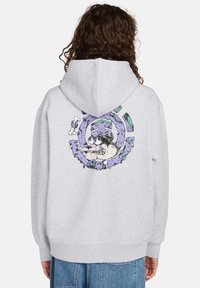 Sudadera con capucha gris que presenta un colorido diseño de dibujos animados en la parte posterior con un patrón circular y un personaje estilizado. Puños y dobladillo acanalados.