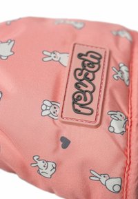 Compact pink fabric pouch featuring a rabbit pattern. A prominent logo plate in soft pink, with black lettering, decorates the surface.