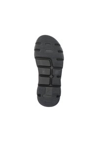 Semelle de chaussure en caoutchouc noir avec motif de crampons pour l'adhérence, surface texturée et bords pour la stabilité. Comprend le logo de la marque dans le design.
