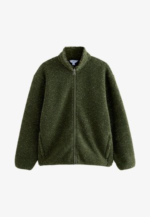 Vihreä vetoketjullinen fleecetakki, jossa on korkea kaulus ja pehmeä, teksturoitu kangas, suunniteltu lämmöksi ja rentoon käyttöön.