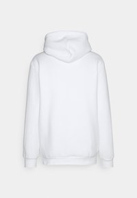 Vit hoodie med standardpassform, långa ärmar, en huva och ribbade muddar och nederkant. Mjuk tyg med en slät yta.