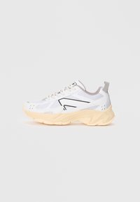 White athletic shoe with mesh and synthetic upper, gray accents, cream-colored sole, textured details, and light lace closure.