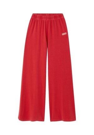 Pantalon rouge à jambes larges avec ceinture élastique et logo « American Vintage » sur la cuisse gauche supérieure, présenté sur un fond blanc.