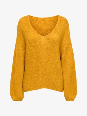 Pull oversize jaune moutarde avec un col en V profond, un motif en maille texturée, et des manches ballon, avec des poignets et un ourlet côtelés.