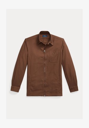 Brown zip-up jacket made of cotton with a collared neck, single chest pocket, and side pockets. Smooth texture and fitted sleeves.