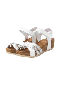 Sandalias blancas con cuña de corcho, que cuentan con una banda plateada texturizada y tiras suaves blancas. Correa ajustable en el tobillo para un ajuste seguro.