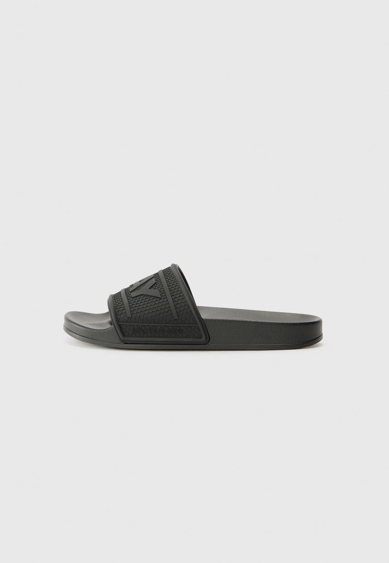 Black rubber slide sandal with textured upper, featuring a horizontal band and logo detail. Smooth sole, simple design, lightweight.
