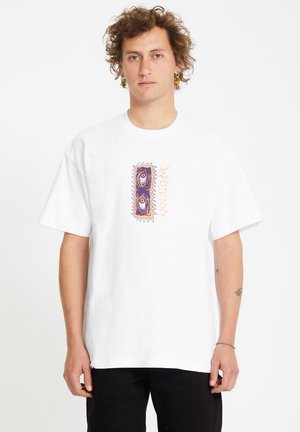 White cotton t-shirt with a boxy fit, featuring a central graphic design in purple and orange, surrounded by abstract pattern accents.
