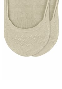 Beige, knöchelhoche Socken aus strukturiertem Stoff, mit einem Silikonrutschmuster für verbesserte Traktion auf der Sohle.