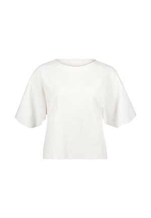 Haut blanc à manches courtes avec des manches larges et évasées et un col rond, présenté sur un fond blanc uni.