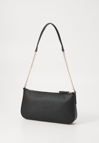 Black leather handbag with a textured finish, featuring a zip closure and a removable golden chain strap. Sleek, elongated shape.