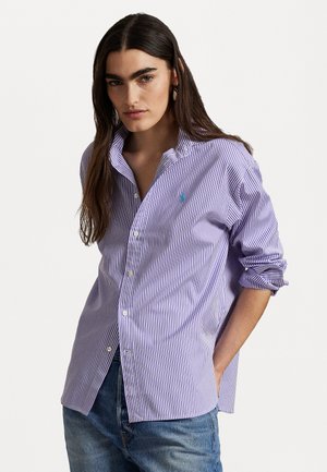 Purple and white striped button-up shirt with a relaxed fit, featuring a classic collar and a small logo on the chest. Cotton fabric.