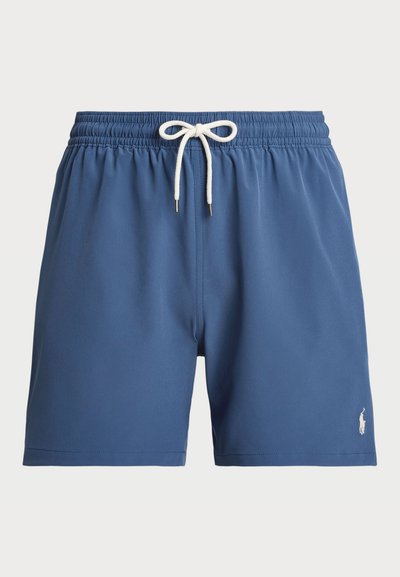 Blue swim shorts with an elastic waistband and white drawstring. Features a small embroidered logo on the lower right. Smooth fabric texture.