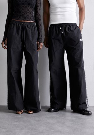 TRACK PANTS UNISEX - Tracksuit bottoms - black