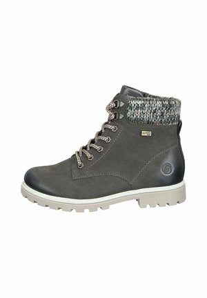 Gray ankle boots made of leather with a knitted cuff, sturdy outsole, and metallic eyelets. Contrast laces enhance the design.