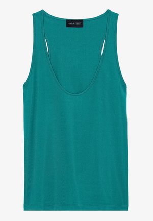 Teal ermeløs tanktop laget av myk stoff. Har en dyp utringning og utskårne detaljer på baksiden for bedre ventilasjon.