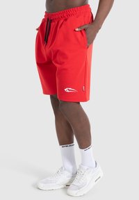 Smilodox Pantalón corto de deporte - red
