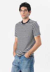Short-sleeve crew-neck t-shirt in navy and white stripes, featuring a small chest pocket and a contrasting collar. Soft cotton fabric.