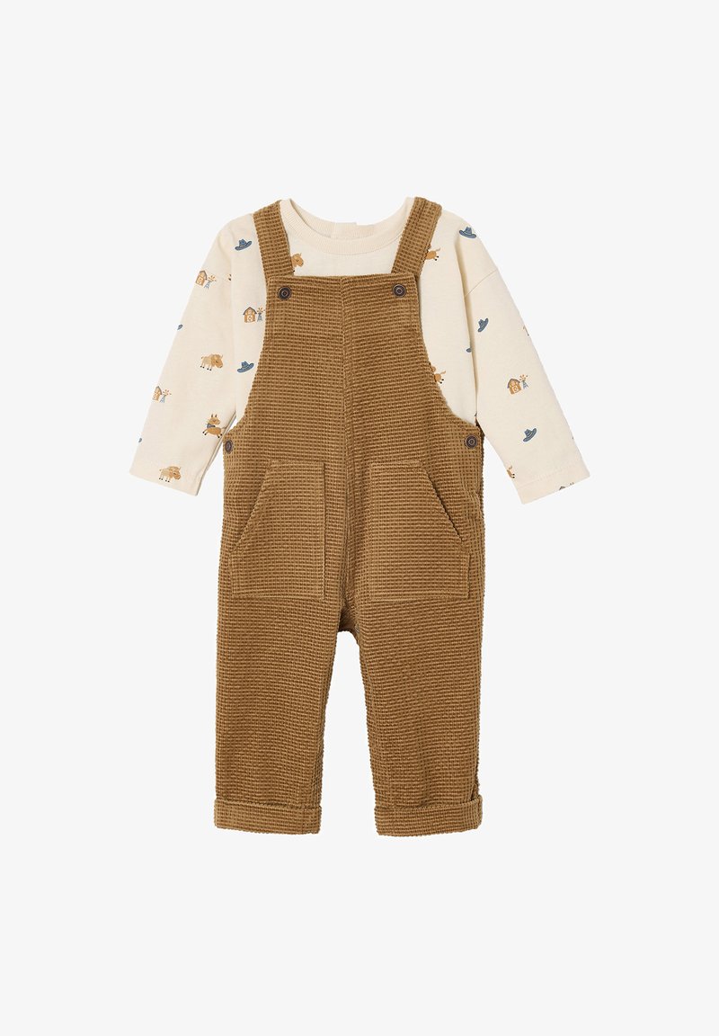 Brown corduroy overalls with two front pockets, adjustable straps, and a cream long-sleeve shirt featuring animal prints and blue accents.