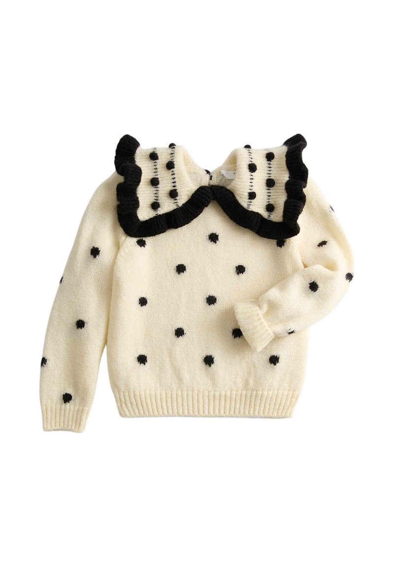 Crèmekleurige gebreide trui met zwarte stippen en een grote geplooide kraag afgezet met zwart.