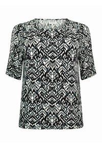 Krátký černobílý vzorovaný top s geometrickými a abstraktními designy, kulatým výstřihem a lehkým materiálem.