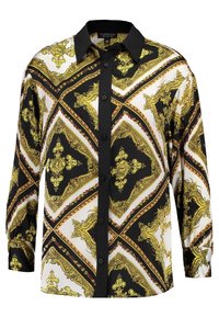 Košile na knoflíky s černým límcem, zdobená bohatým zlatobílým vzorem na černém a krémovém podkladu, s dlouhými rukávy.