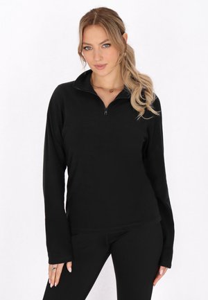 Zwarte rits-pullover gemaakt van zachte stof, met een hoge kraag en lange mouwen. Gladde textuur met een getailleerd ontwerp.