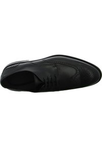 Schwarze Lederschuhe mit runder Zehenform, dekorativen Perforationen und Schnürung vorne. Glatte Textur mit kontrastierenden Nähten.