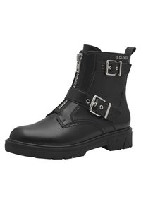 Black leather ankle boot with a textured finish, side zipper, and dual silver buckles. Features a thick rubber sole with a tread pattern.