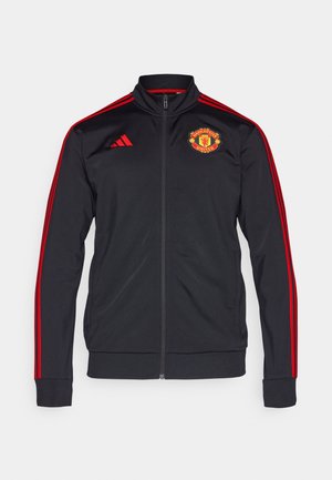 Zwarte zip-up jas met rode strepen en boorden, met het logo van Manchester United aan de linkerkant. Gemaakt van gladde stof.