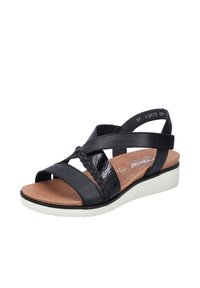 Svart sandal med korsade läderremmar, texturerade detaljer och en stoppad sula. Vit kilklack med ett mönster för bra grepp. Storlek 37.