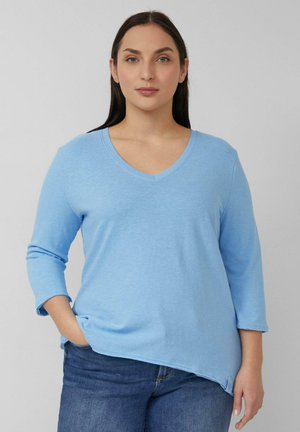 - Bluzka z długim rękawem